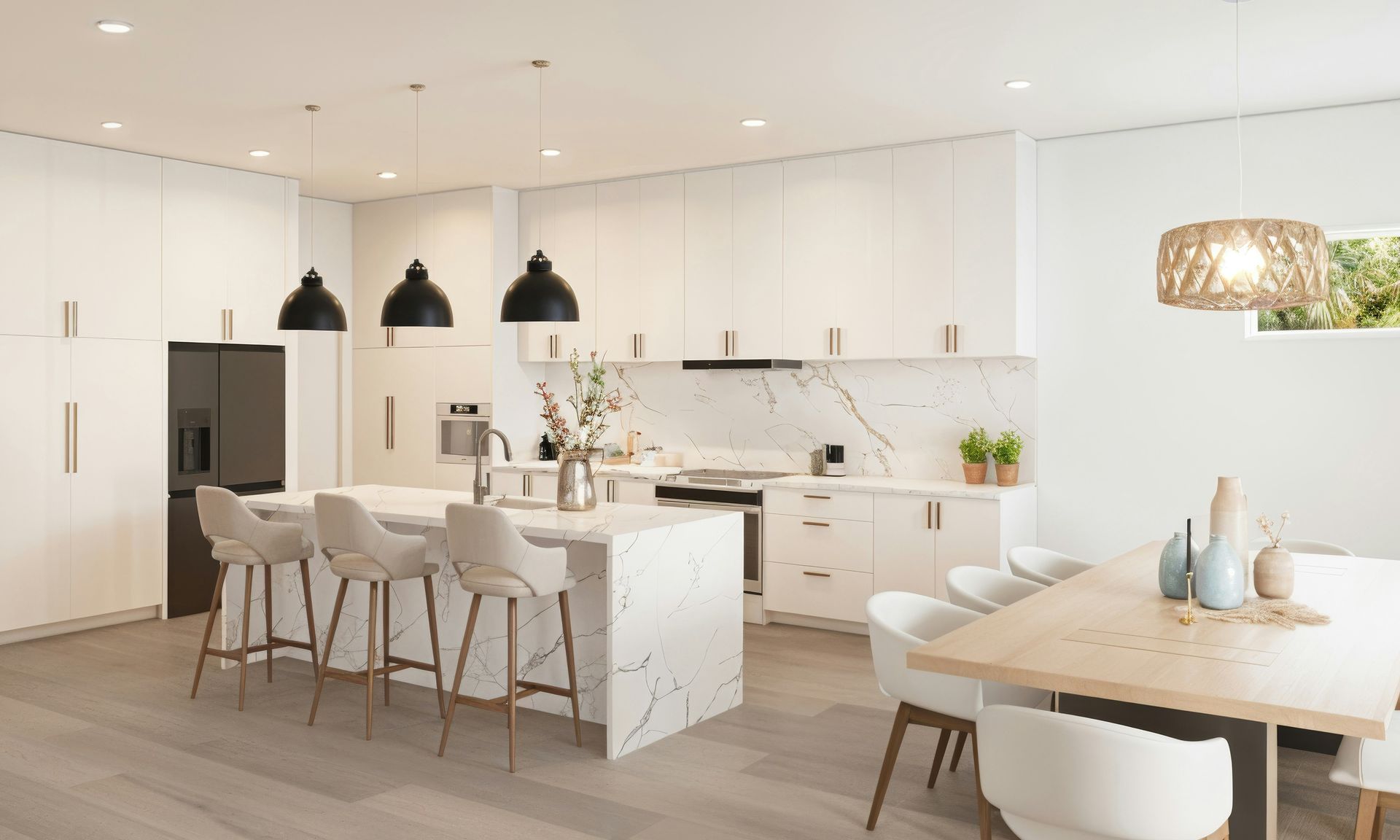 Modern white kitchen with marble island and dining area